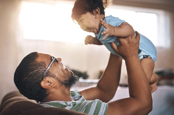 depression - man holding baby